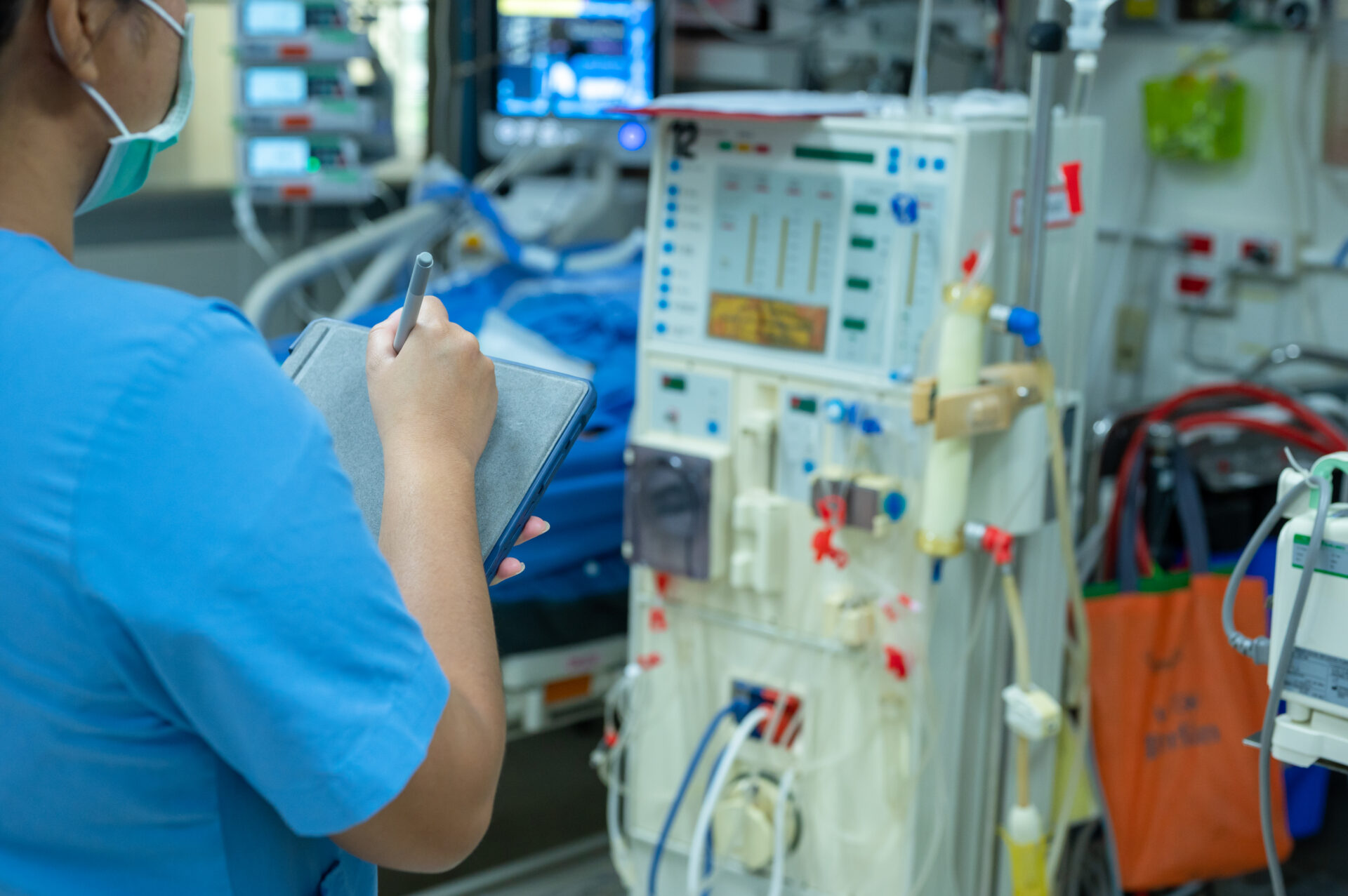 Nurses are checking the function of the hemodialysis machine before use in patients with chronic renal failure.